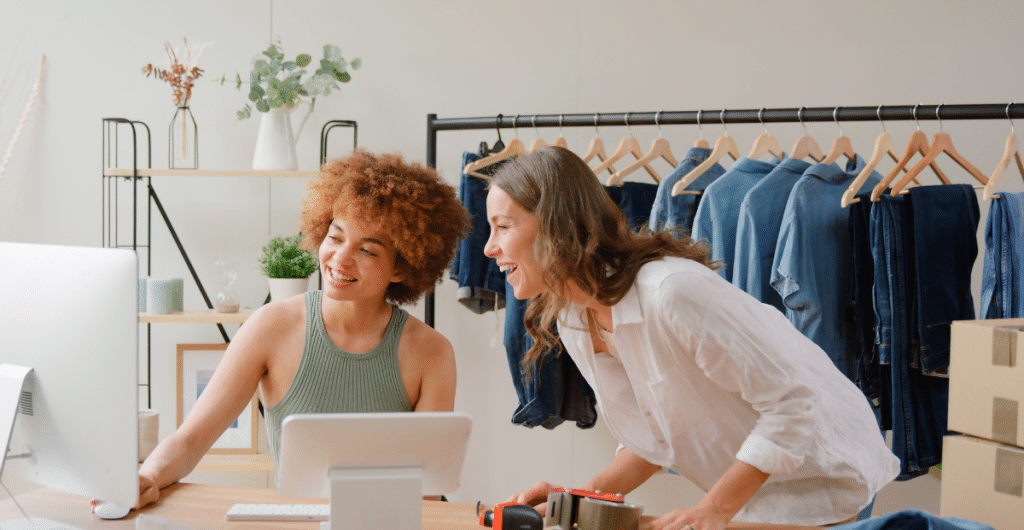 Women business owners looking at online orders