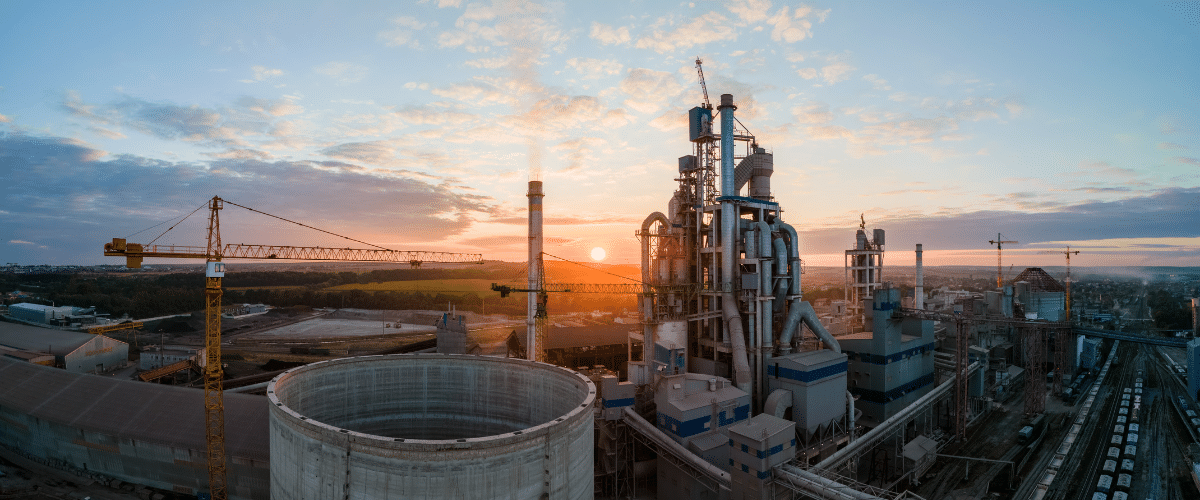 cement factory tower with high concrete plant structure at industrial production area